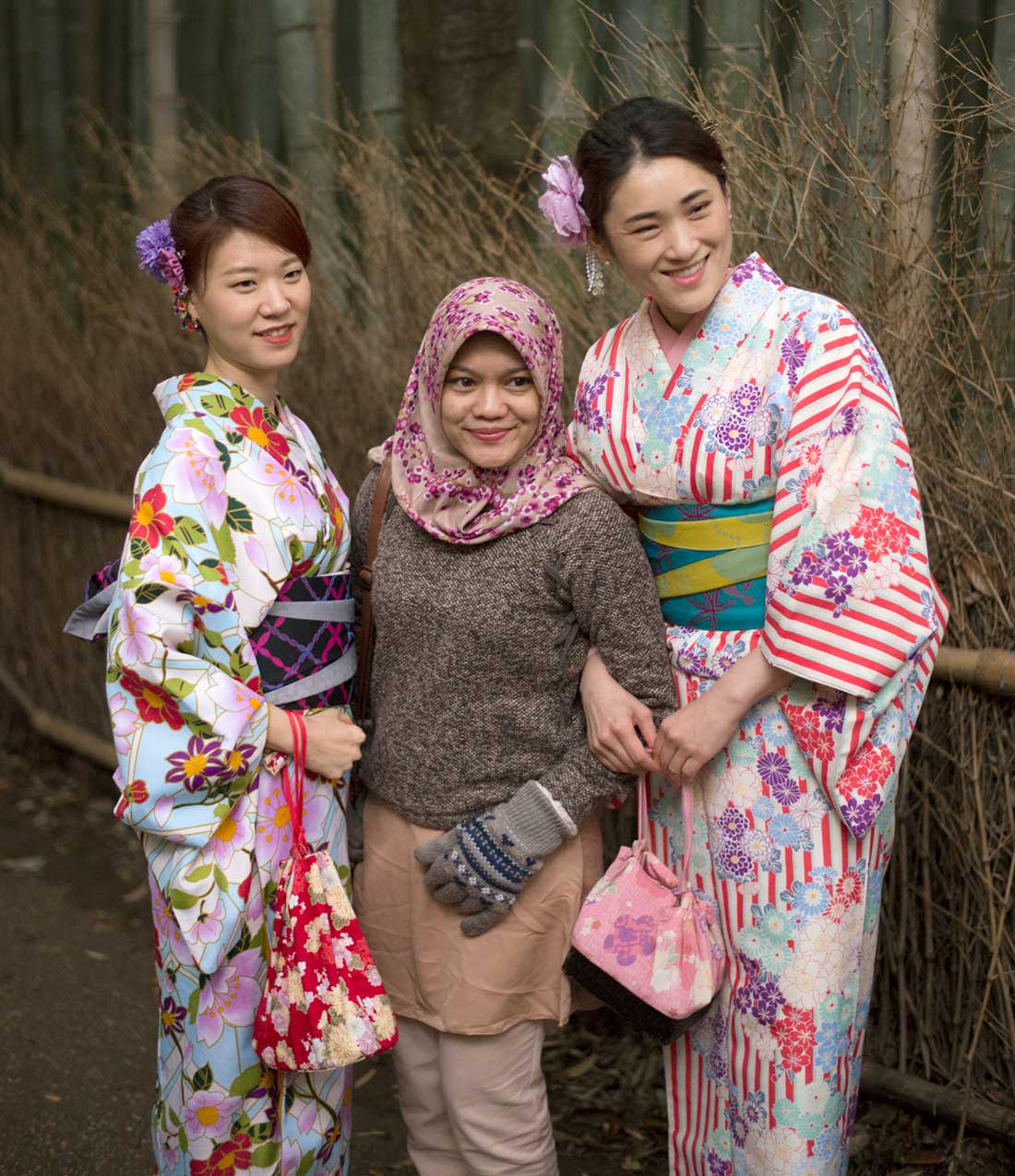 Three women, one with hijab